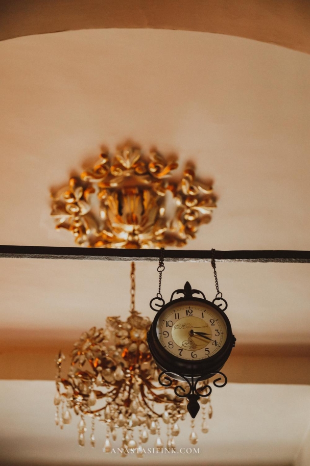 Clock and chandelier inside Azizia Mosque