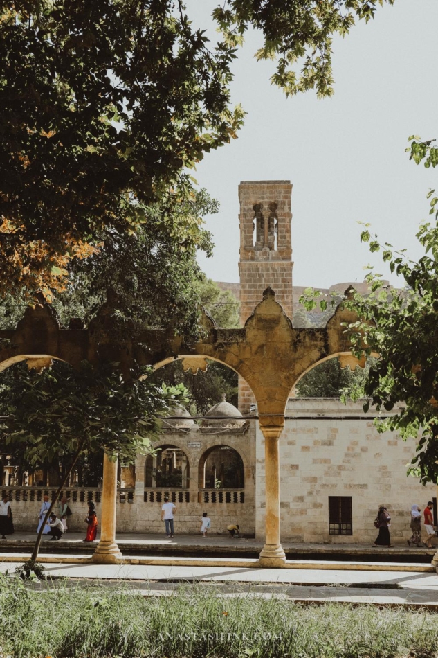 Beautiful arched walkway surrounded by trees at Golbasi Park.