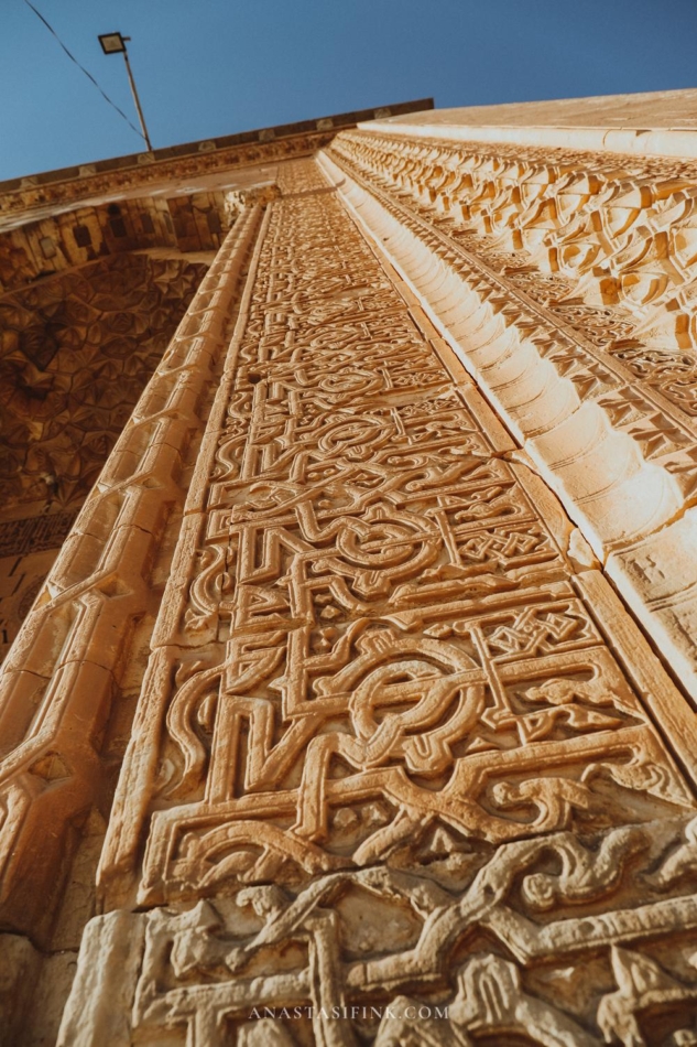 Close-up of intricate carvings on the wall of the Mardin Grand Mosque.