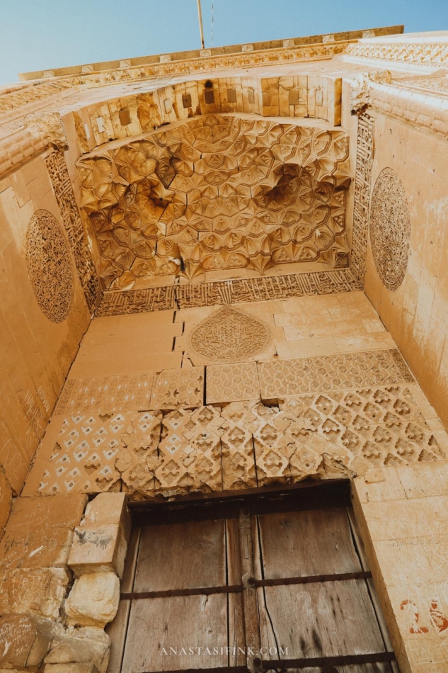 Ornate entrance of the Mardin Grand Mosque with detailed carvings.