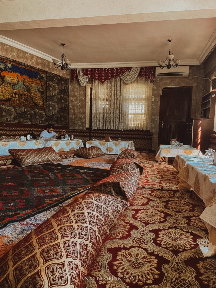 Interior view of a traditional restaurant in Sanliurfa with elaborate decor.