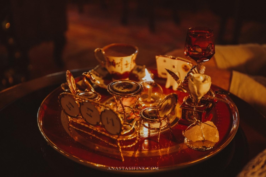 A beautifully arranged traditional tea set featuring ornate cups and golden decor.