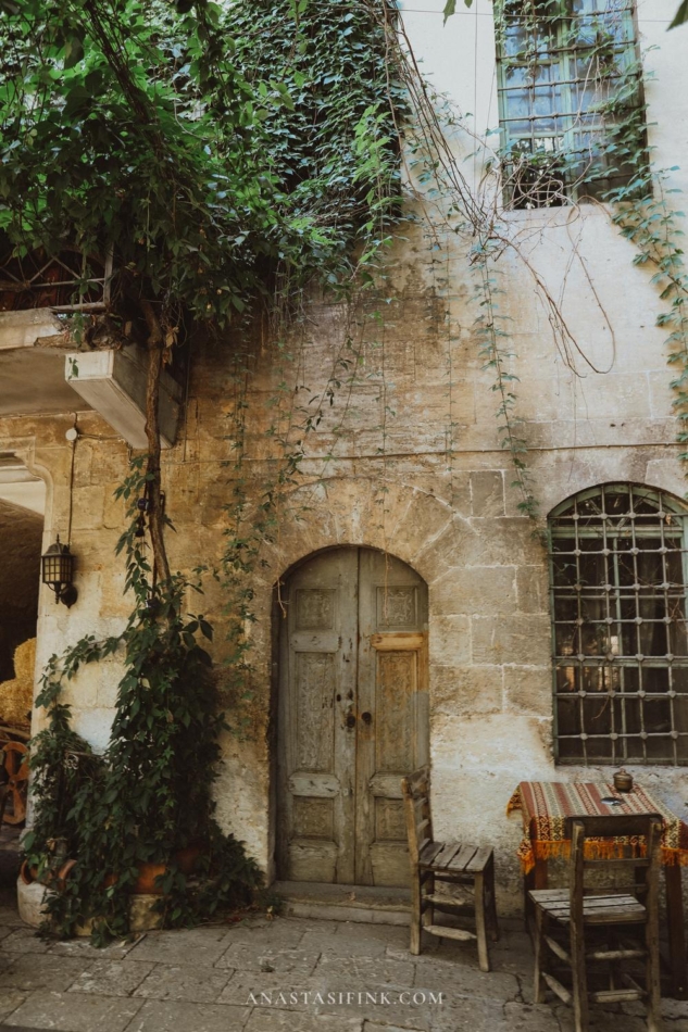 The old doorto the Papirus building with rustic architectural details.