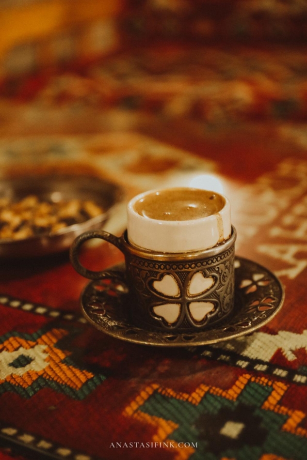 A cup of pistachio coffee served in a traditional cup