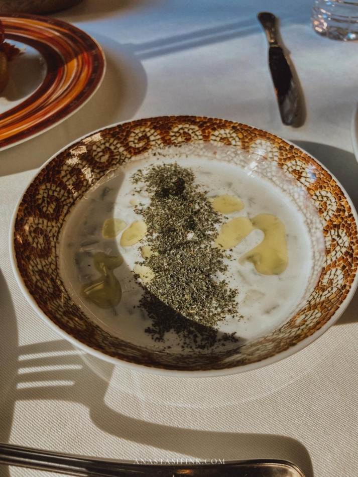 A bowl of yogurt topped with herbs, served at the Mutfak Sanatları Merkezi Restaurant.