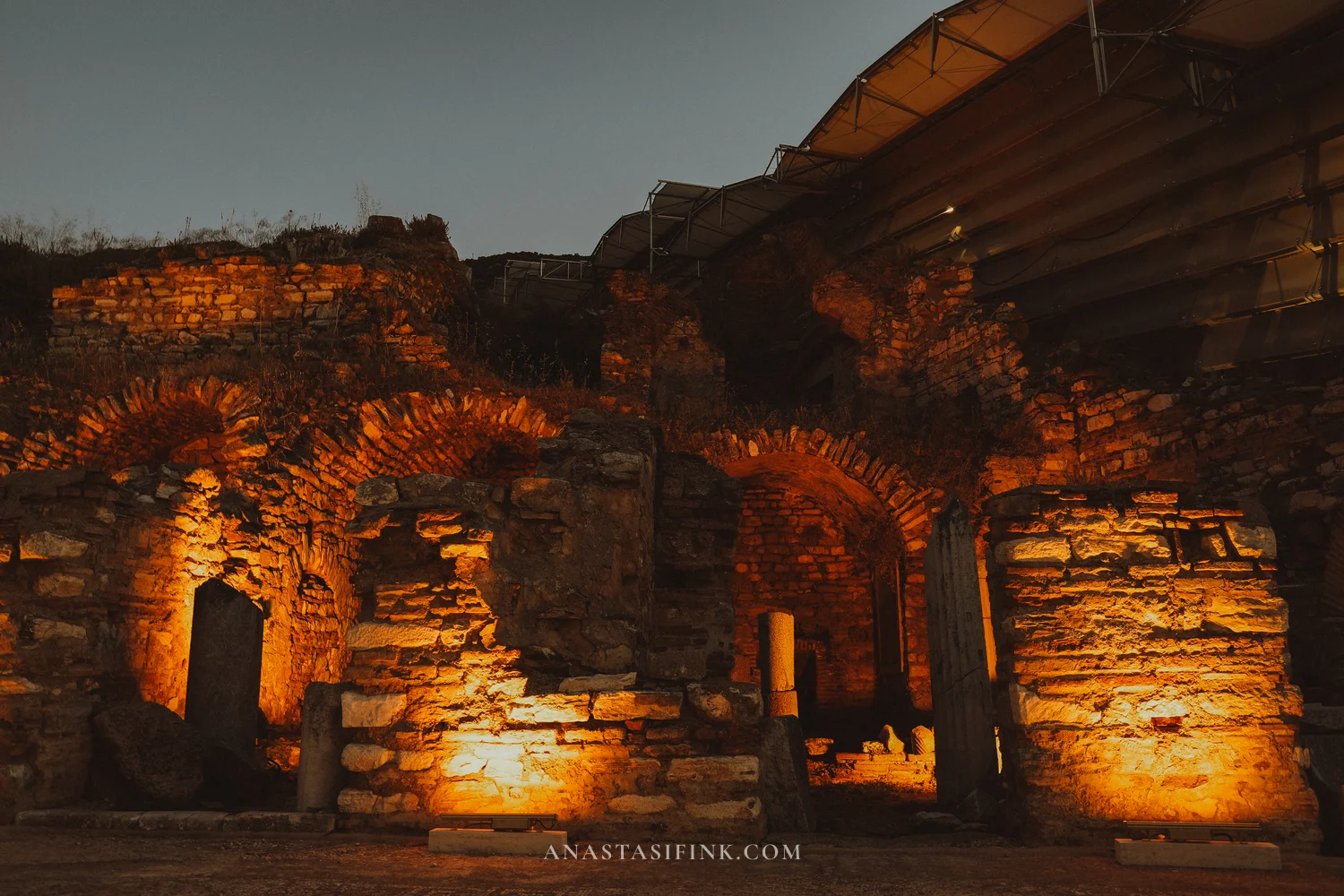 Brick arches in amber night light, close-up