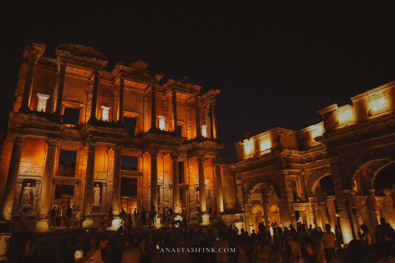 Library of Celsus and Gate of Mazaeus at night with a crowd
