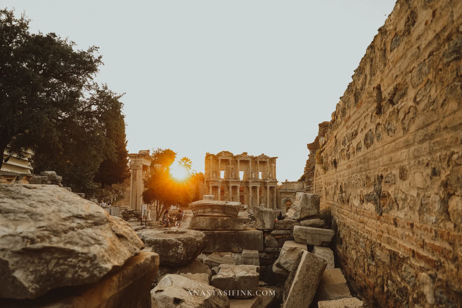 Library of Celsus at sunset, sun flare between the columns