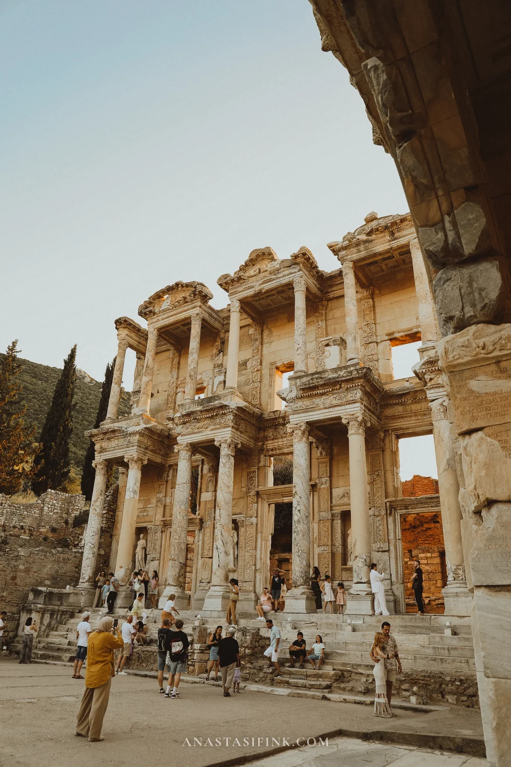 Library of Celsus at sunset — wide shot with tourists
