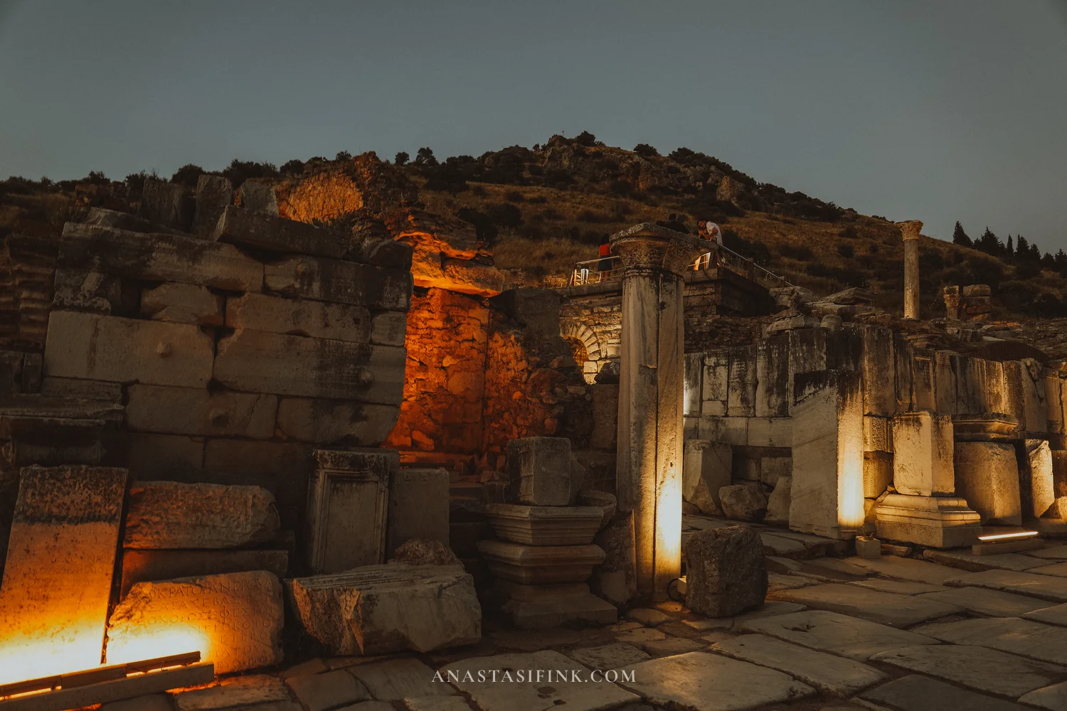 Ruins with illuminated columns at night