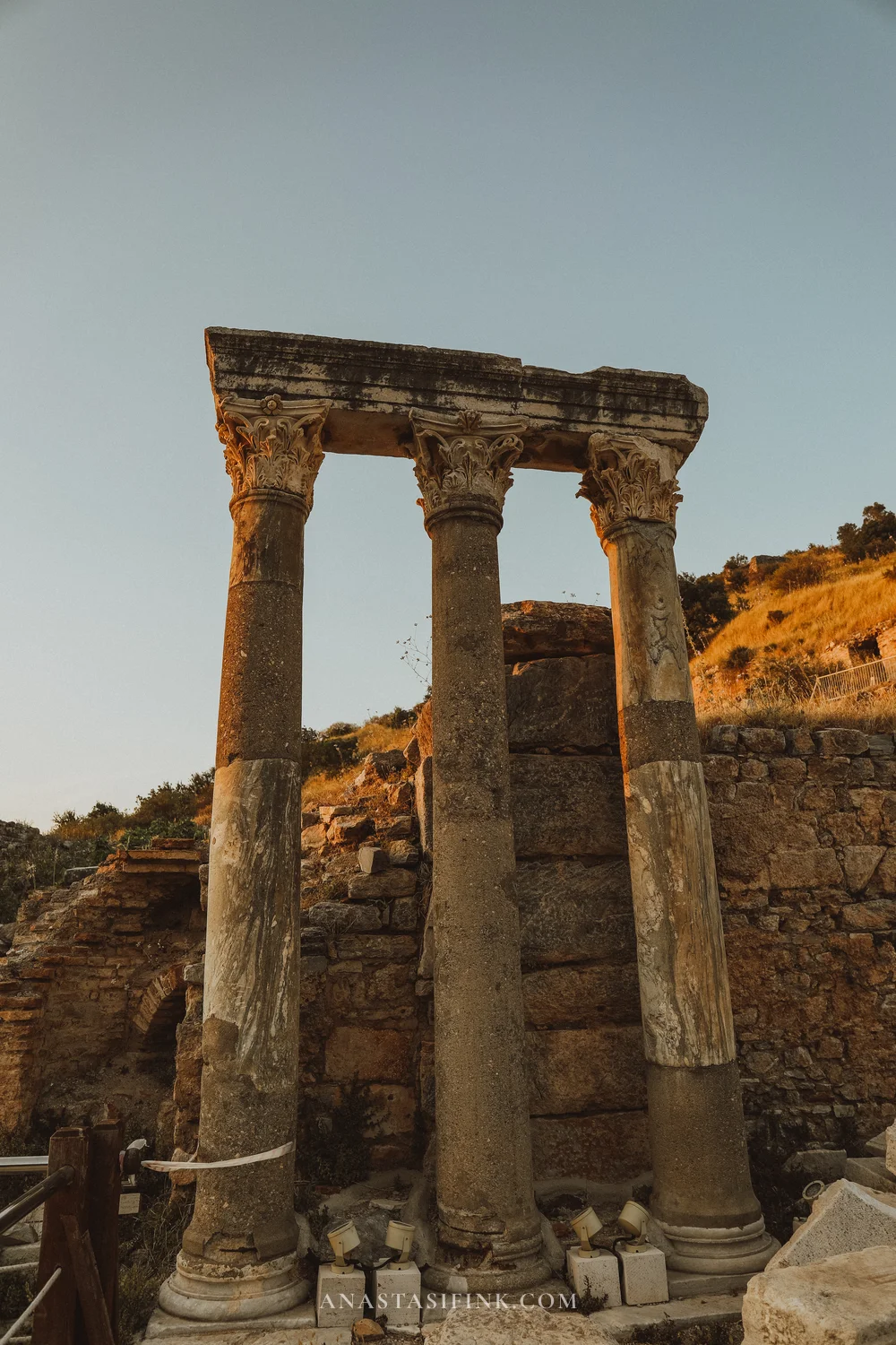 Three columns with entablature in warm golden light