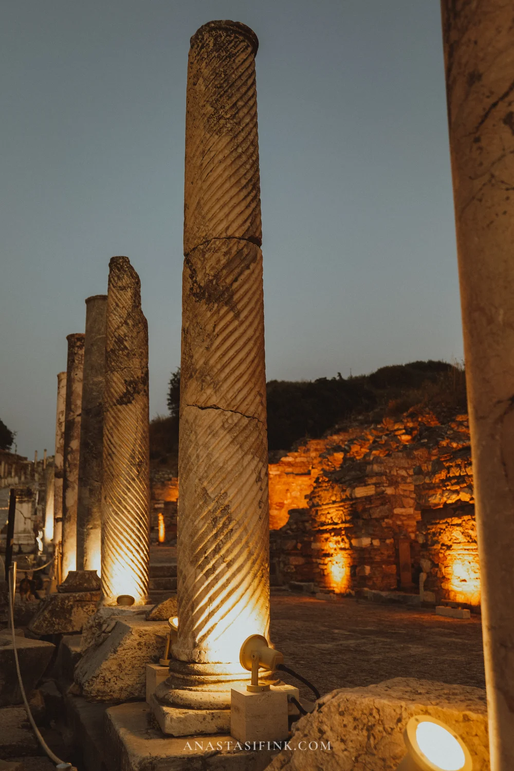 Twisted columns lit from below at night