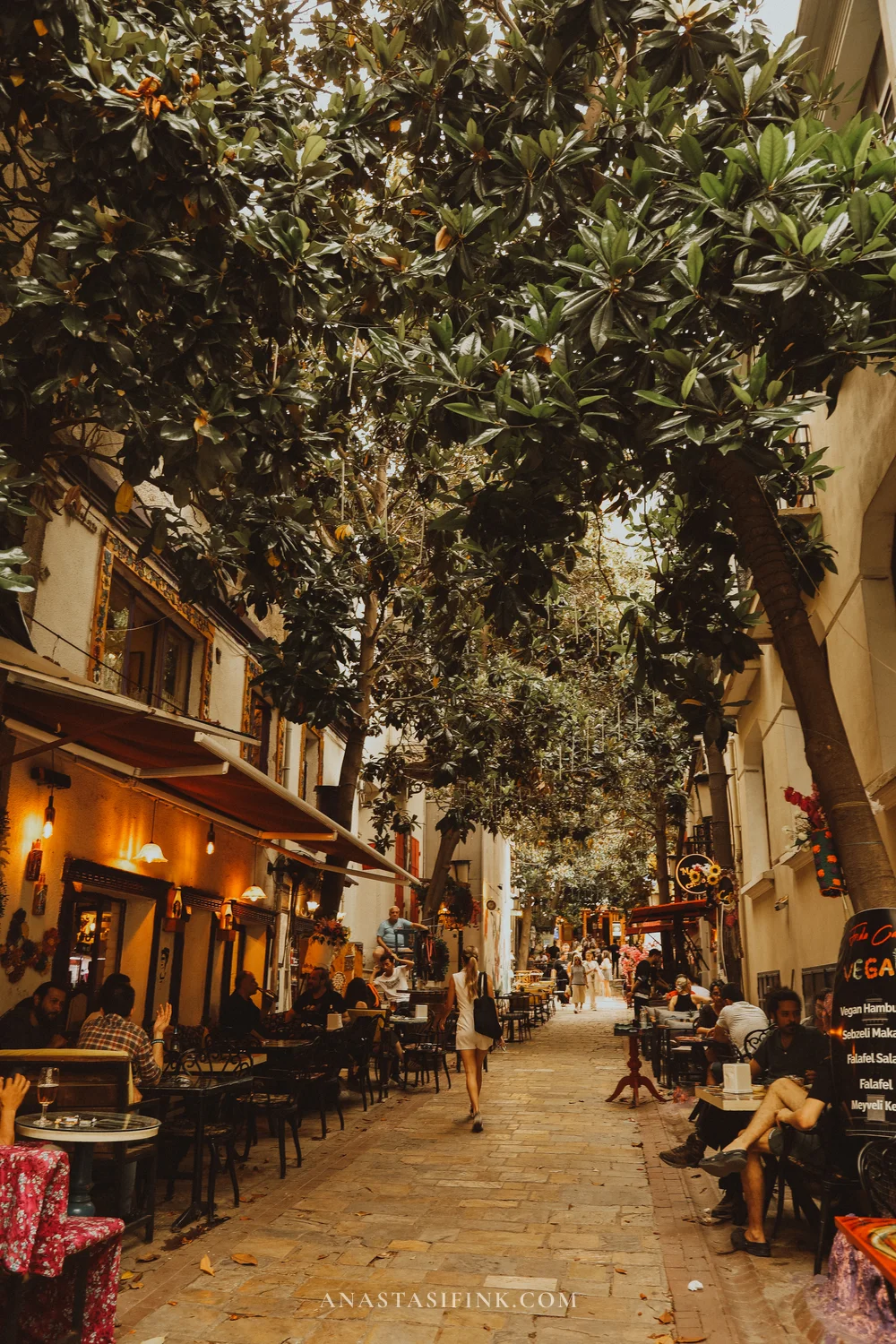 Dario Moreno Street — quiet pedestrian lane with cafes under trees