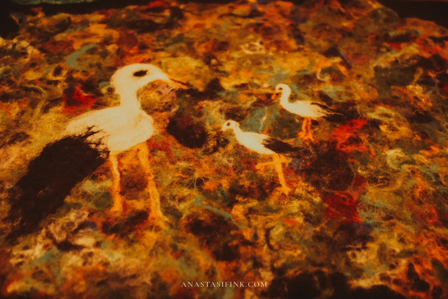 Felt paintings with birds — close-up