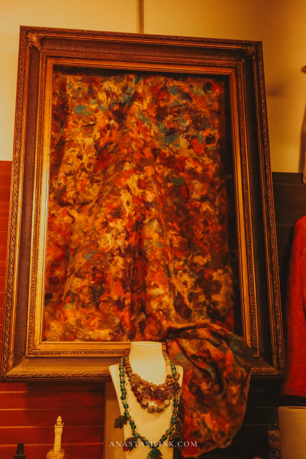 Framed felt art and jewelry — workshop interior