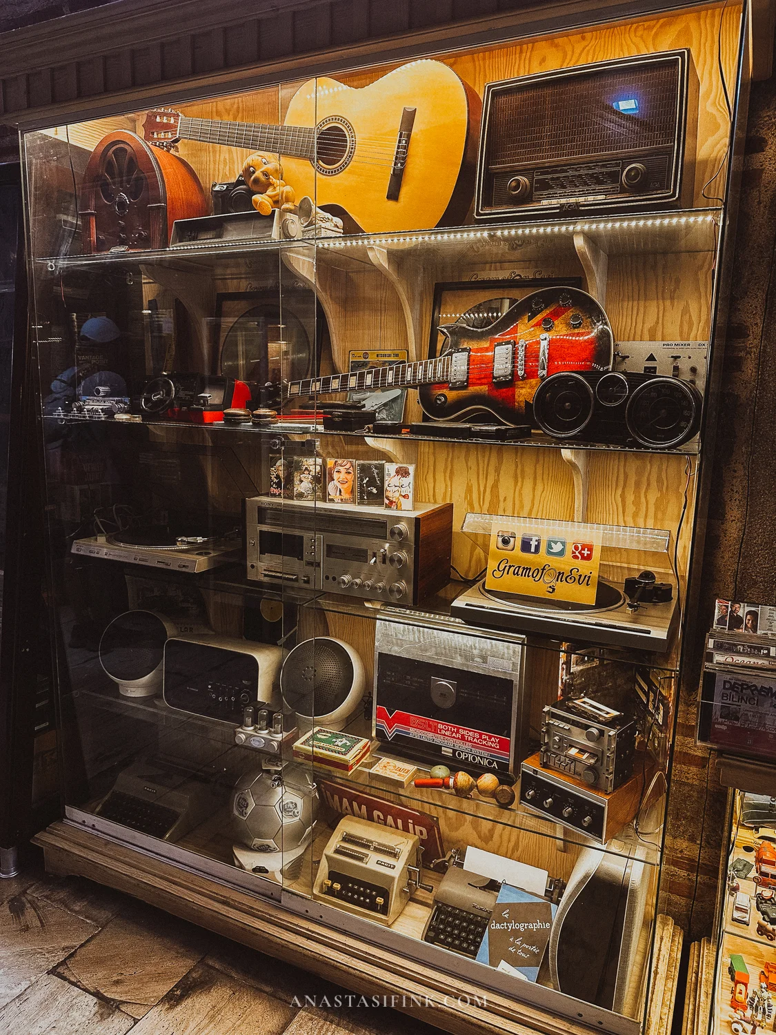 Vintage radios and guitars display