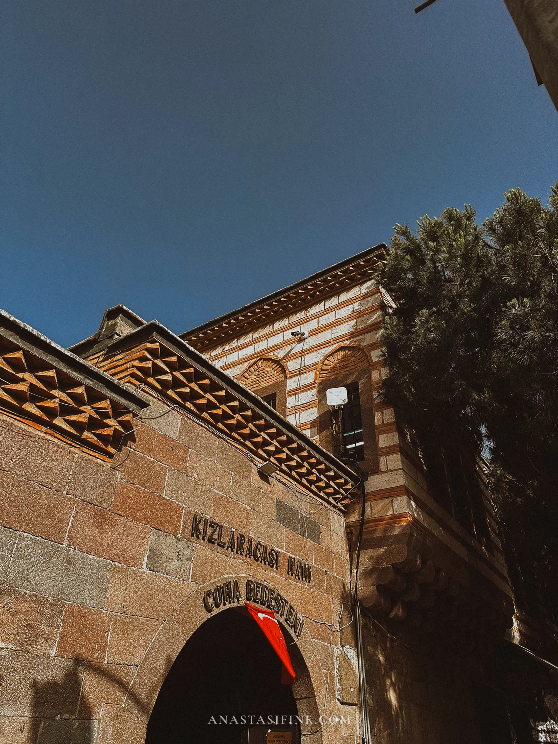 Entrance to Kizlaragasi Han — Cuma Bedesteni inscription points to its trading past