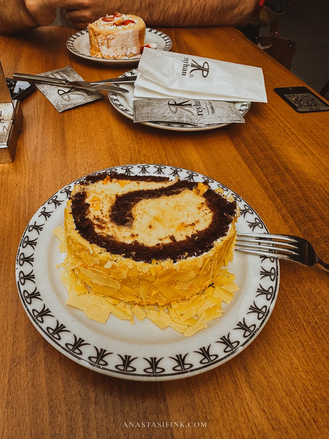 Reyhan's signature cake with chocolate layers and white chocolate shavings