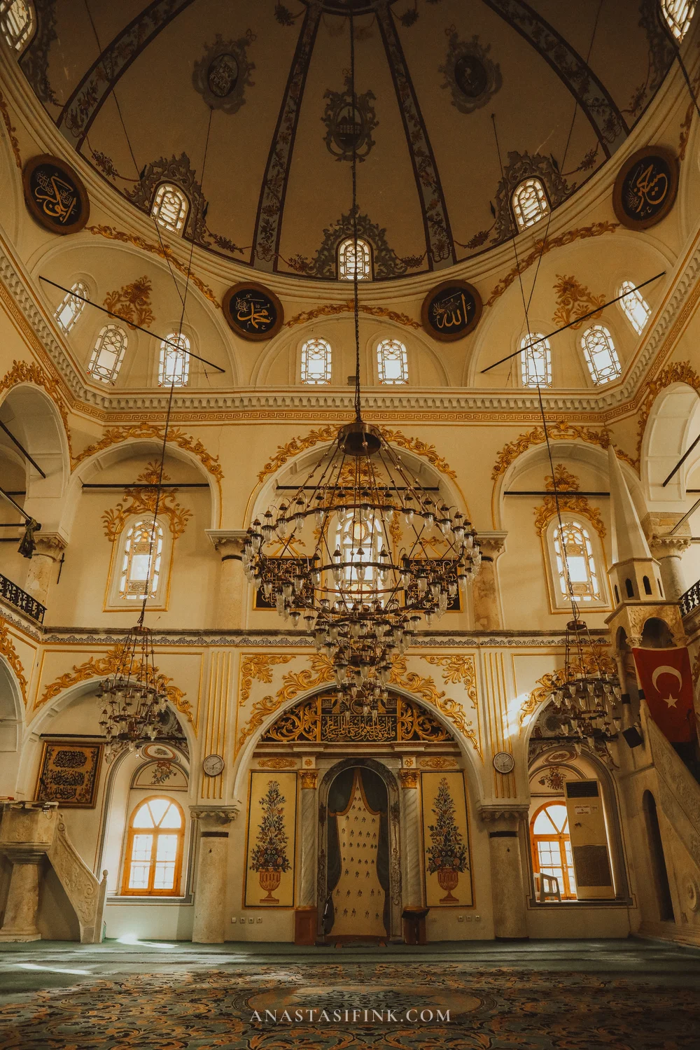 Sadirvanalti Mosque — central chandelier and painted mihrab