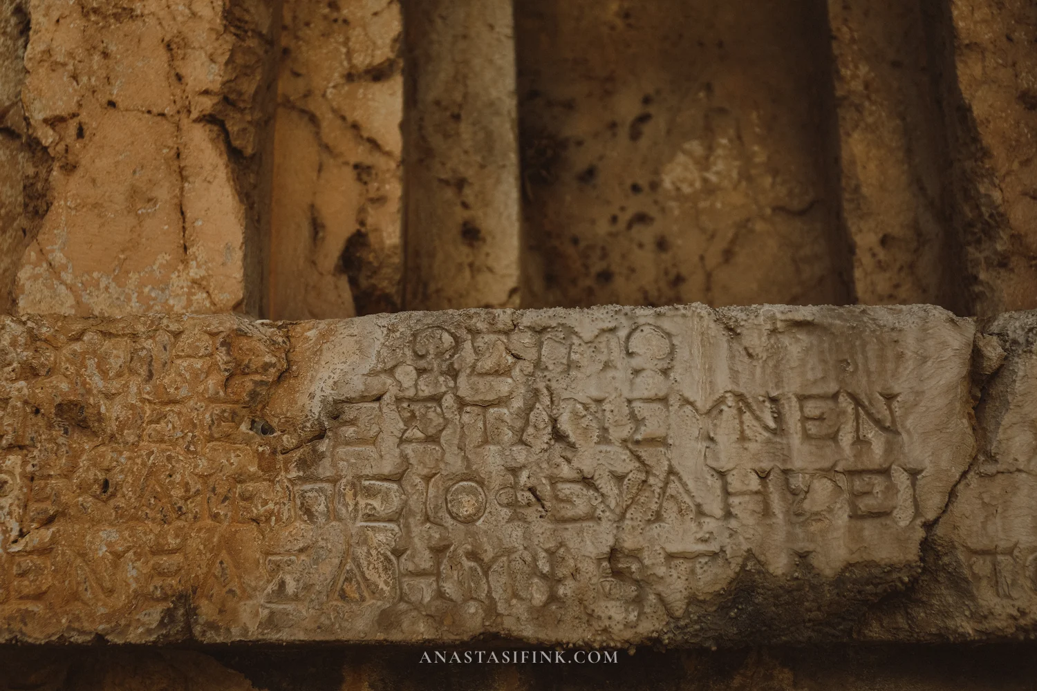 Close-up of carved Greek text on stone