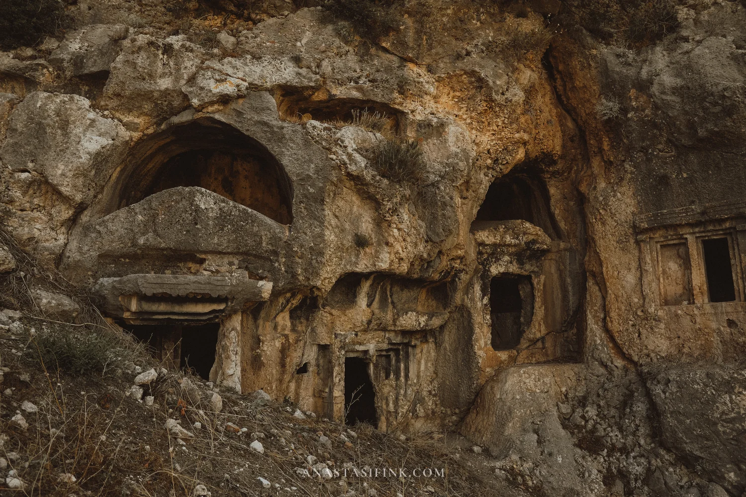 Rock tombs with arched niches