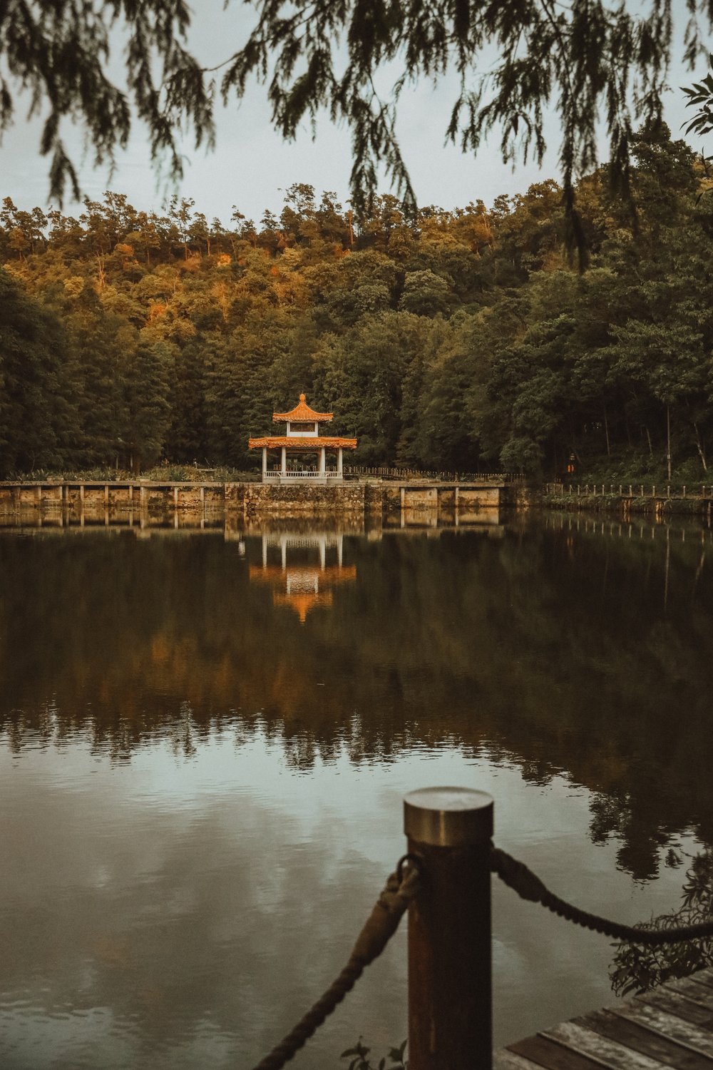 Pavilion of Fairy Lake Botanical Garden reflected in the water