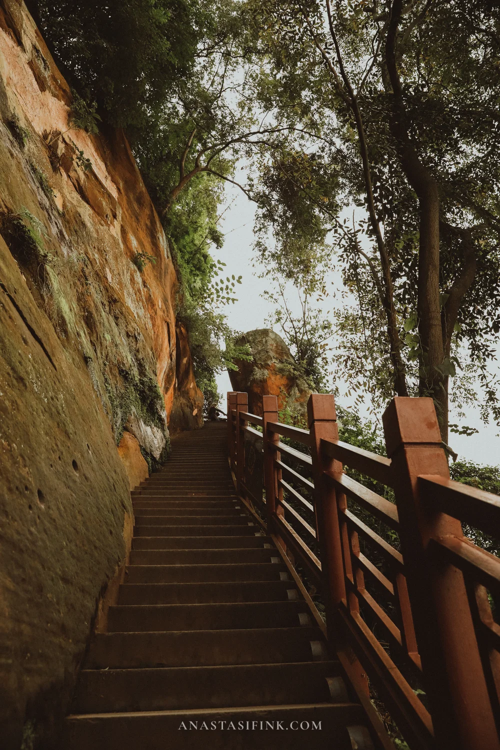Stairway with red railings along the cliff