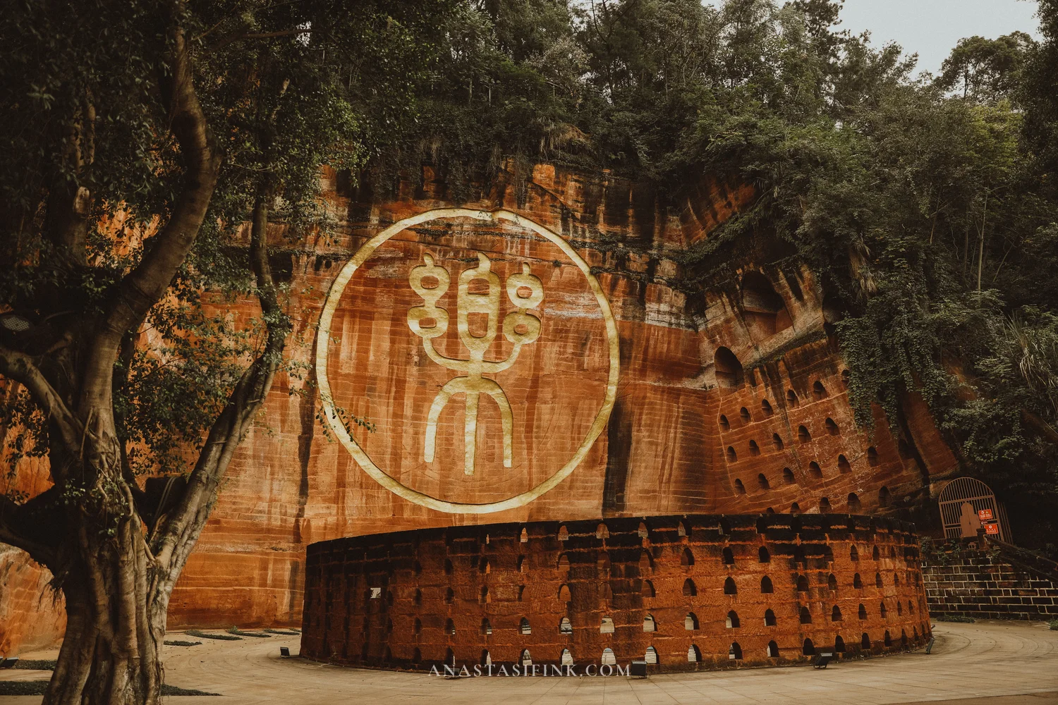 Golden seal symbol carved into the cliff at the Giant Buddha