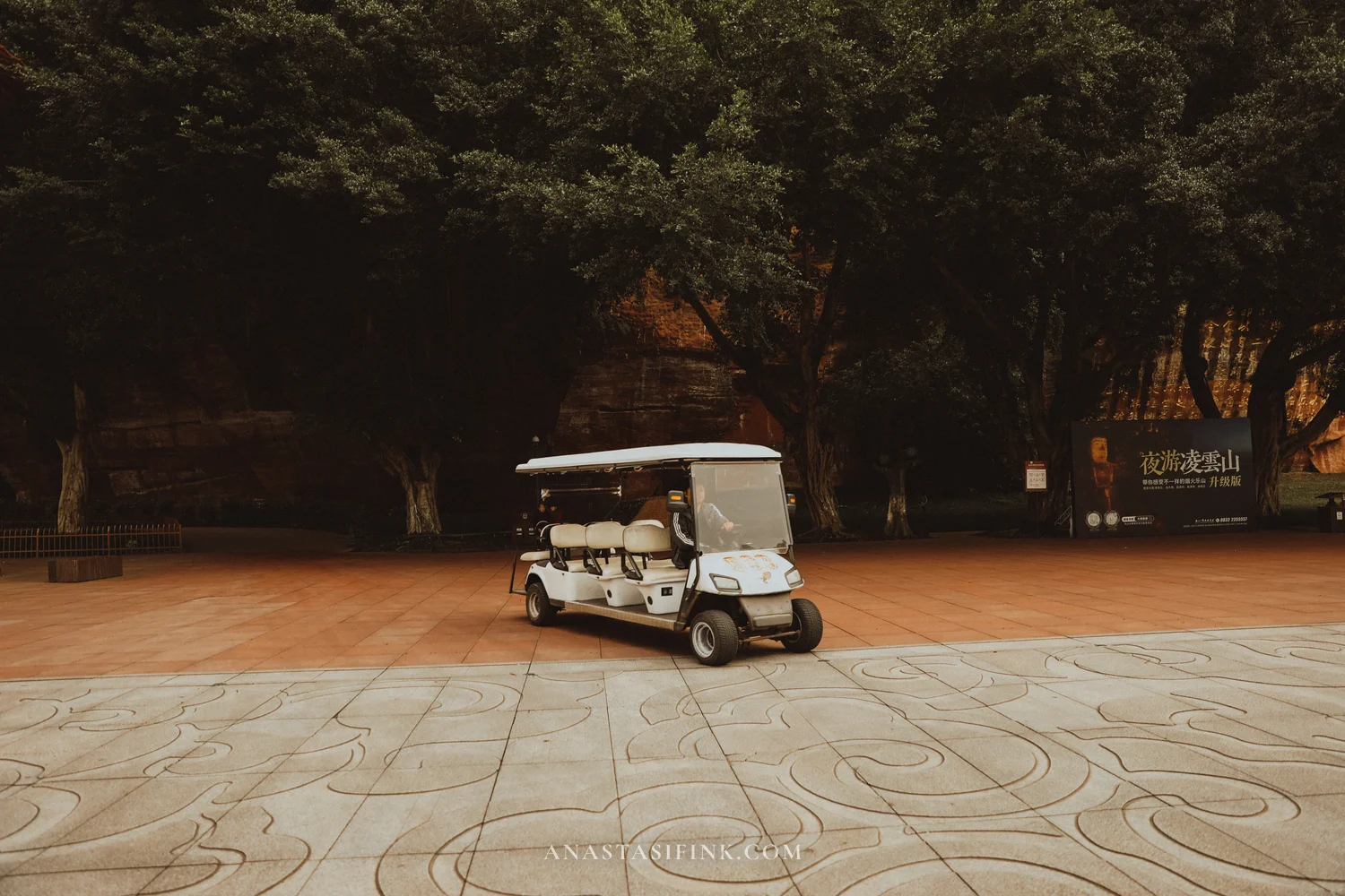 Electric mini-cart on the plaza at the Giant Buddha park