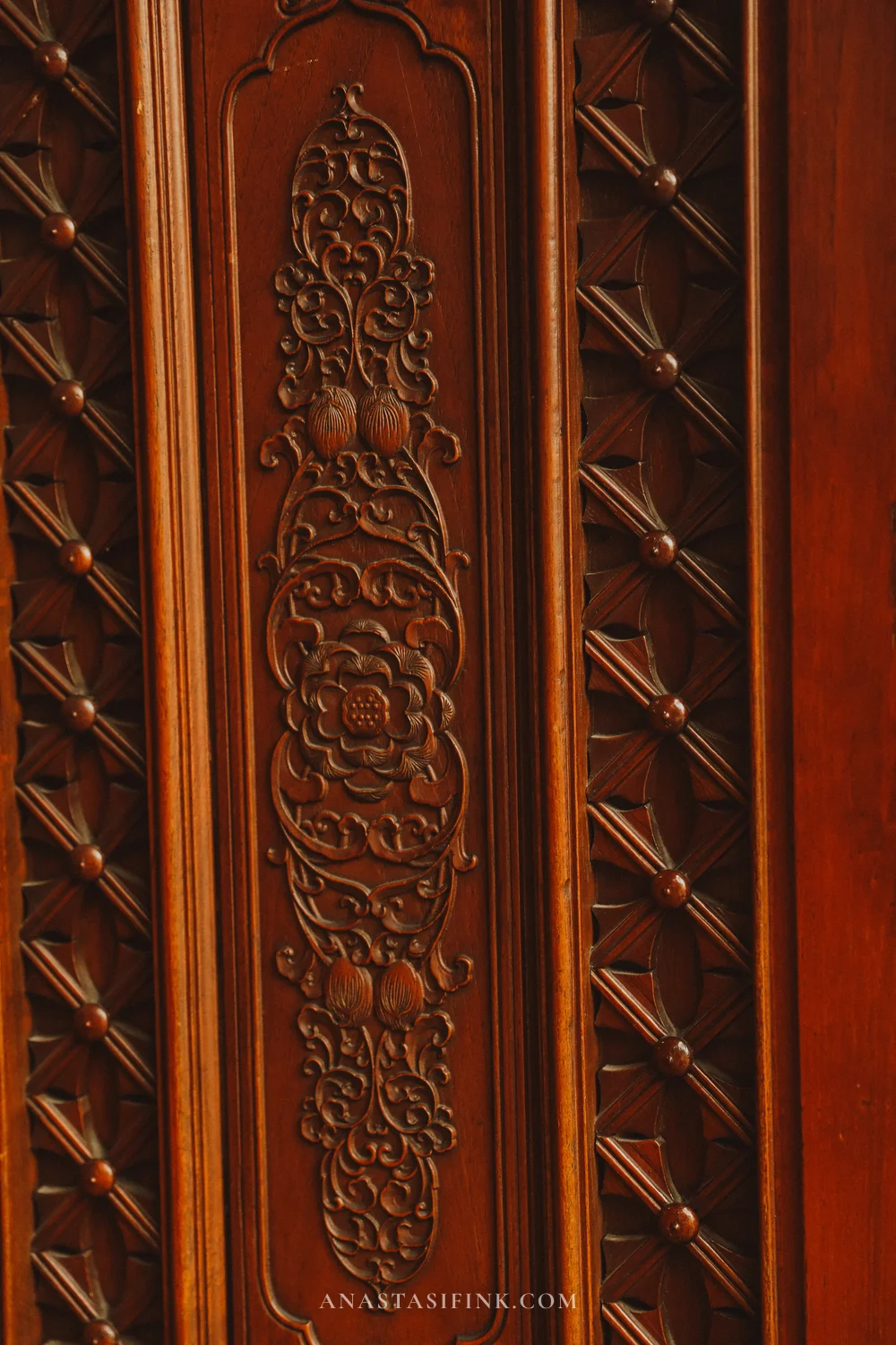 Carving detail on a wooden temple door