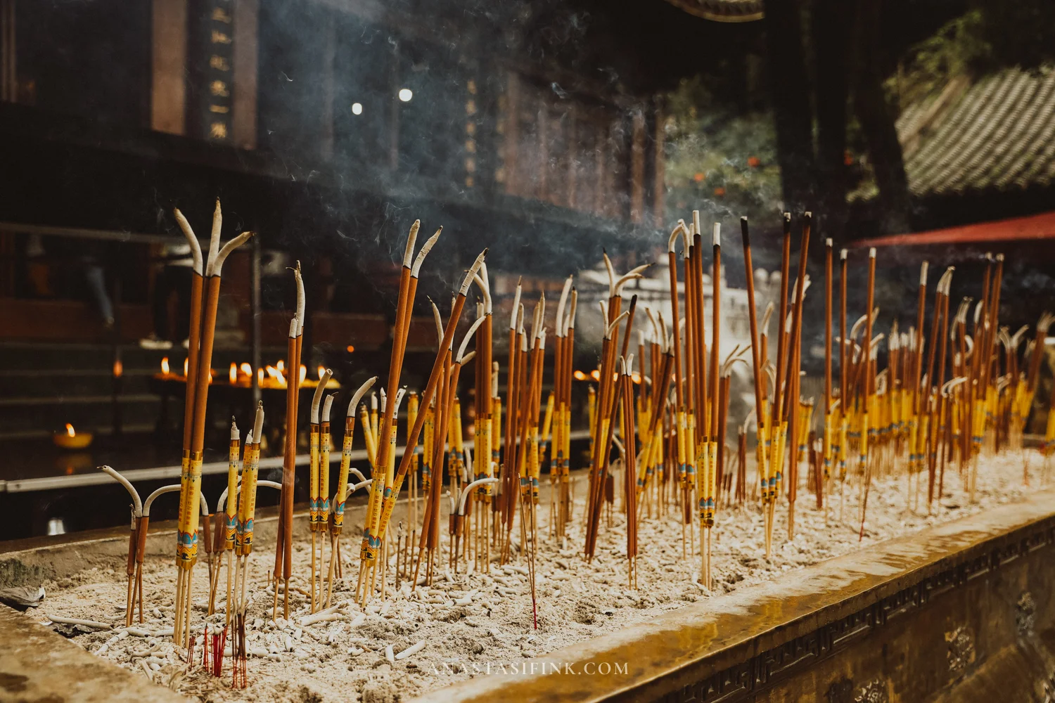 Smouldering incense sticks in the temple
