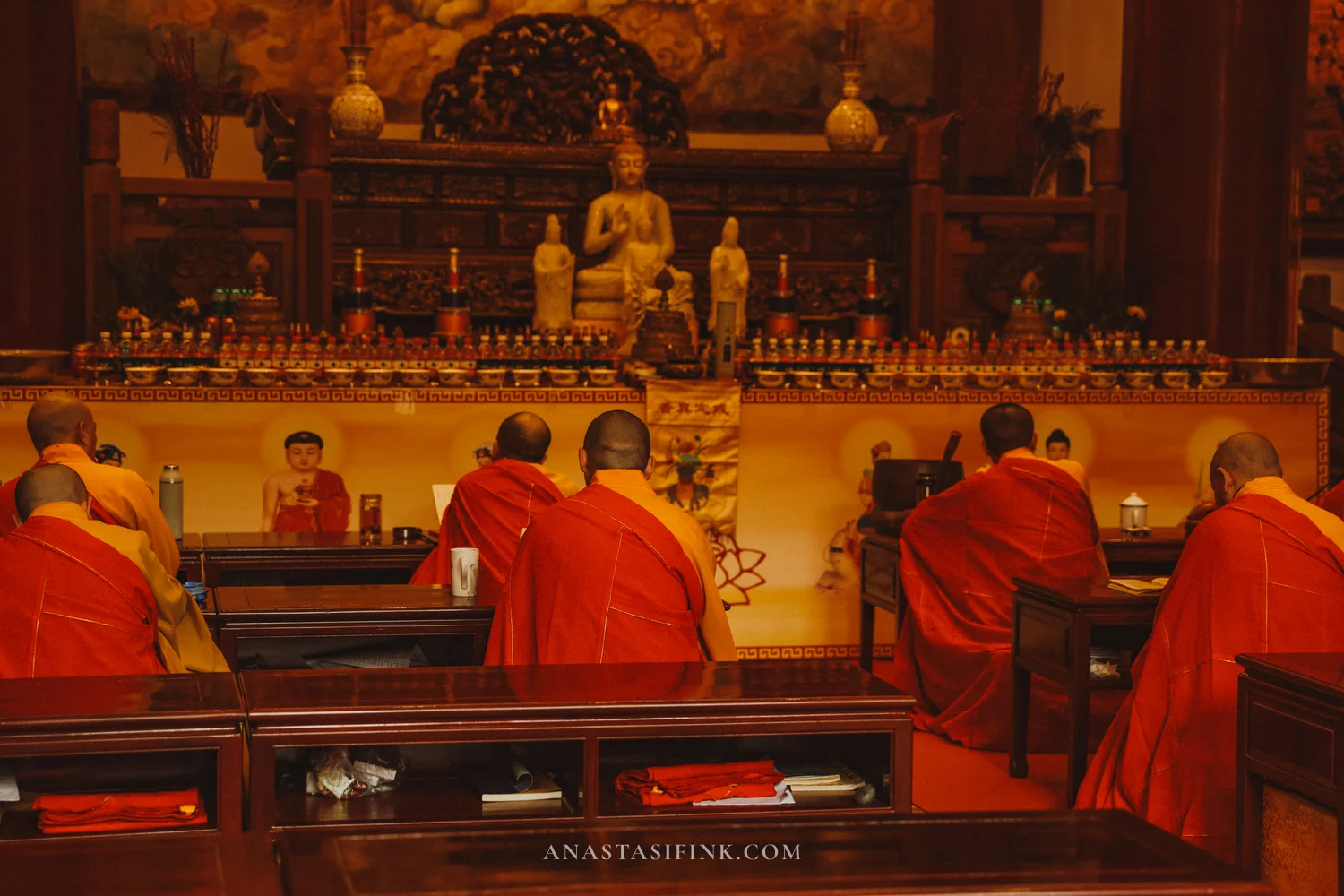 Monks in red robes at a service in Lingyun Temple