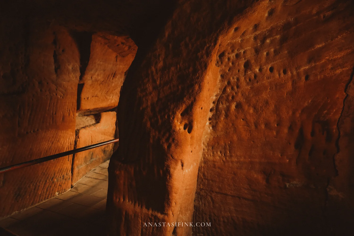 Tunnel cut through red sandstone