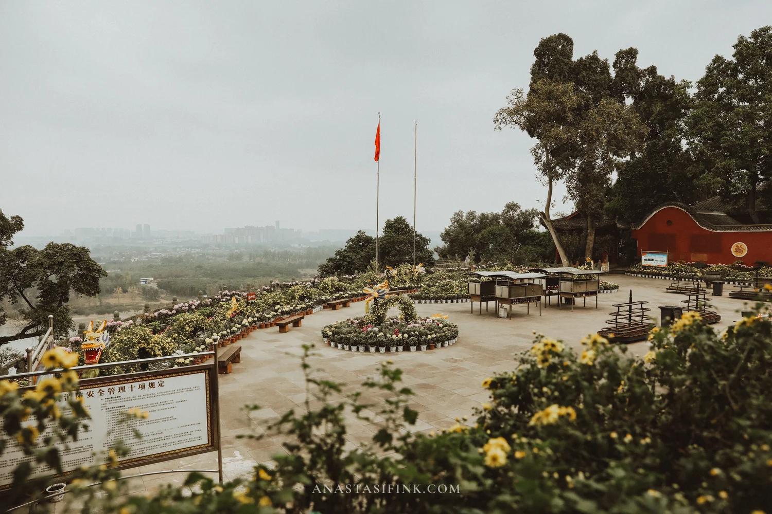 Terrace of Wuyou Temple with a flag and a view of the fields