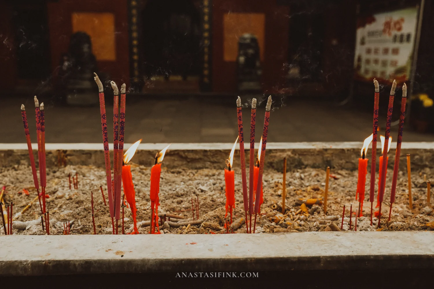 Red incense candles burning at Wuyou Temple