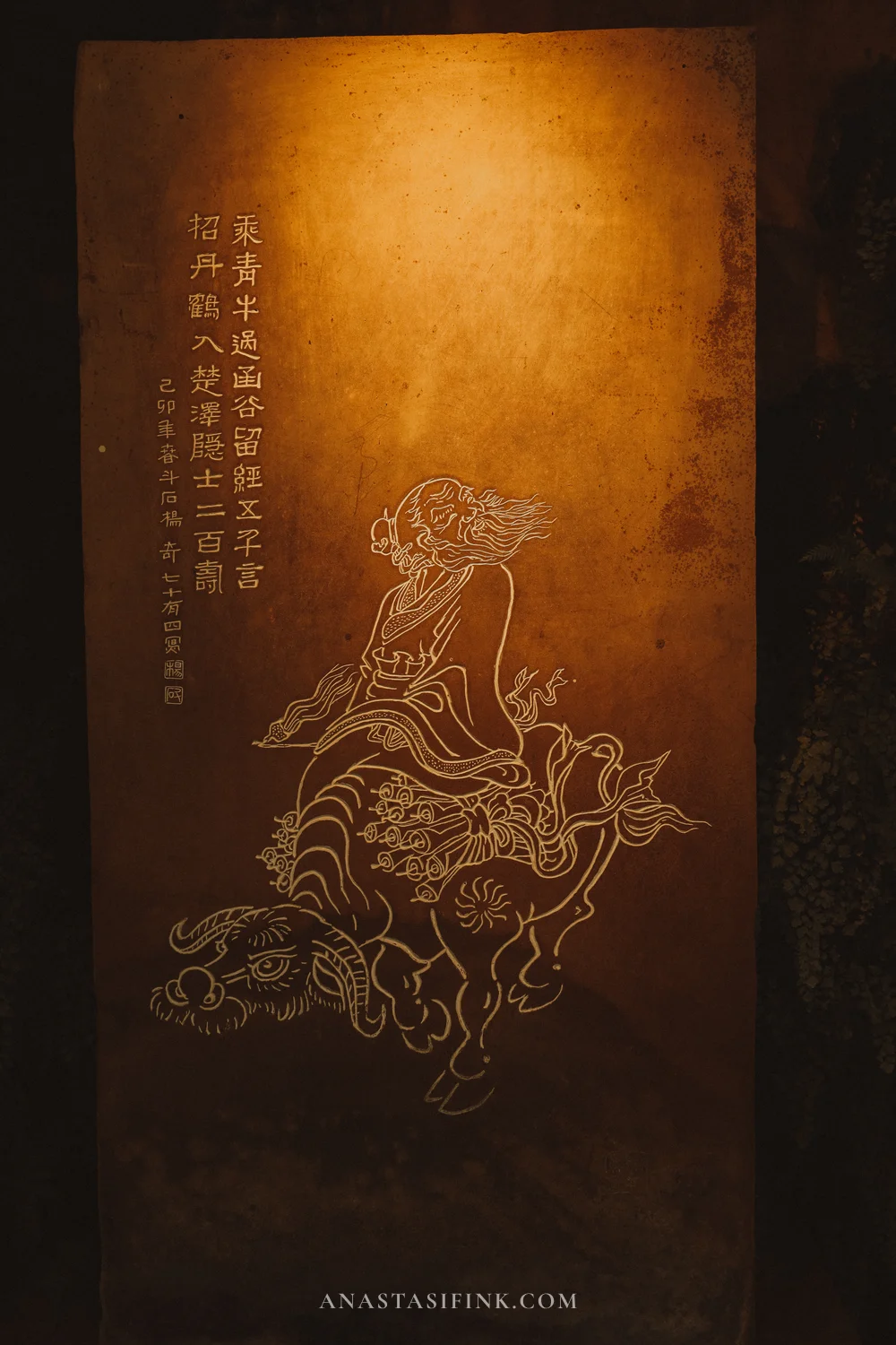 Carving of a Daoist immortal riding a beast