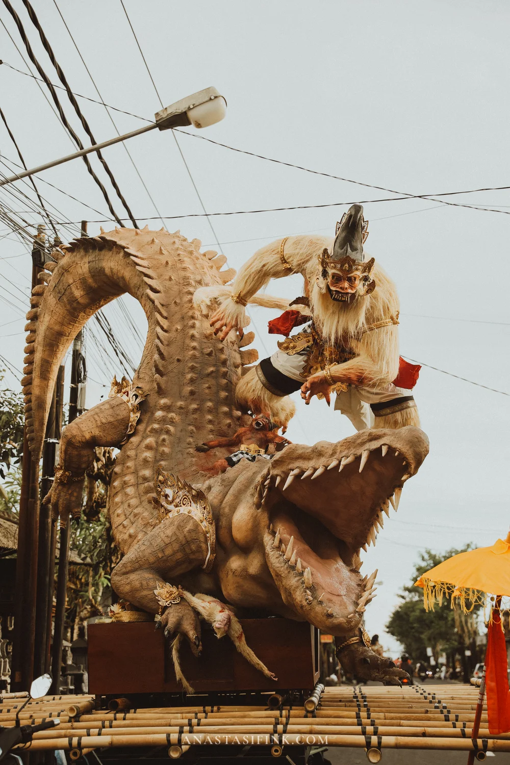 Ogoh-Ogoh battle scene — white monkey attacking a giant crocodile at a Bali street parade