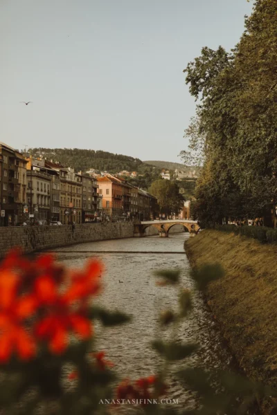 View along the Miljacka river with bridges and hills above Sarajevo