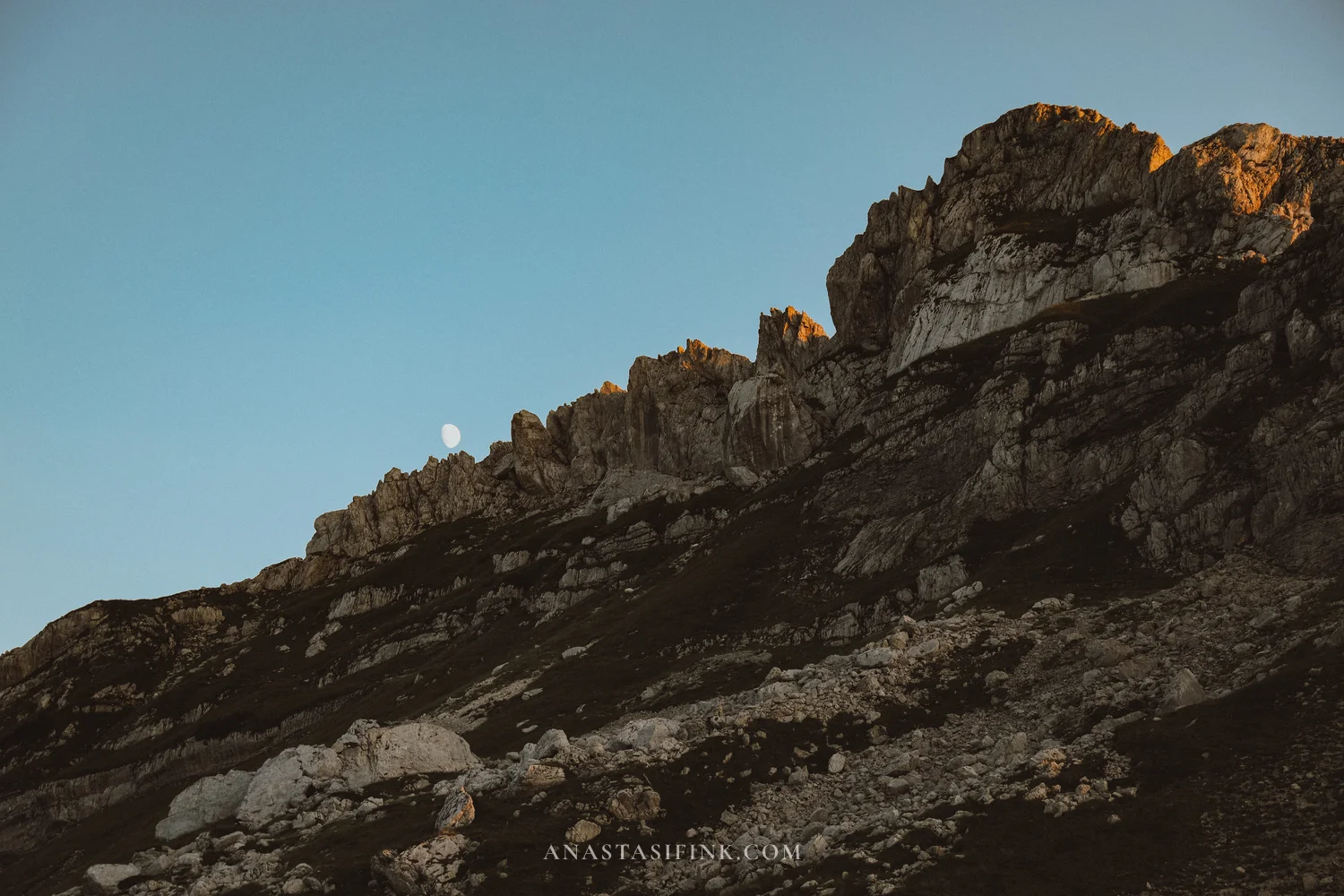 Rocky ridge at Sedlo Pass with the moon at dusk, Durmitor, Montenegro