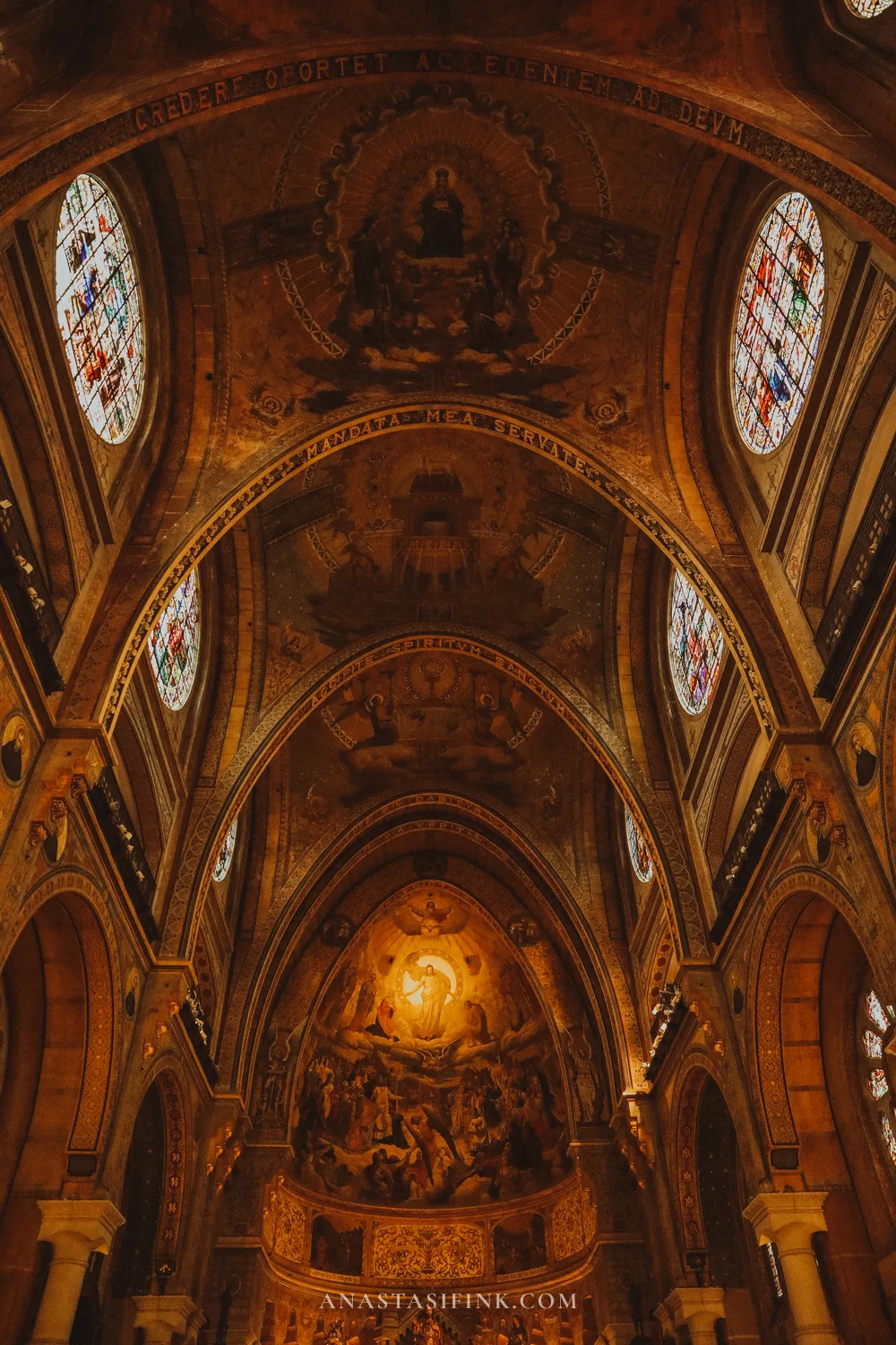 Nave of the Sagrado Corazón basilica in Gijón with painted vaults and round stained-glass windows