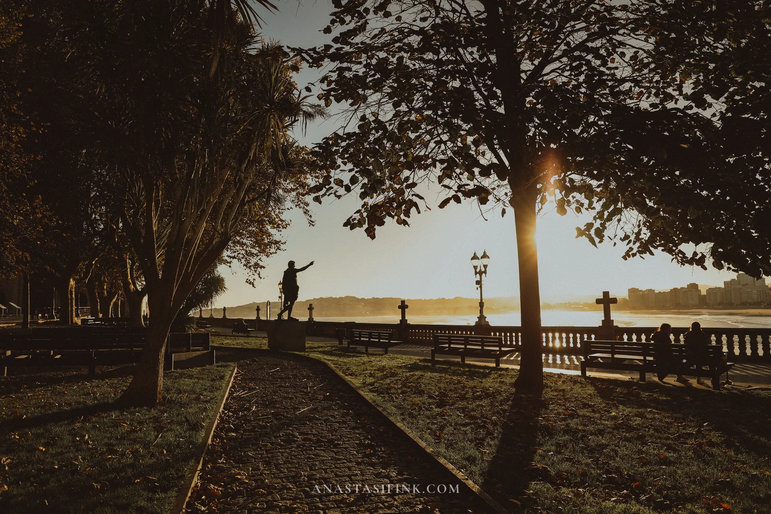 Statue of Emperor Augustus in Campo Valdés park with the sea behind, Gijón