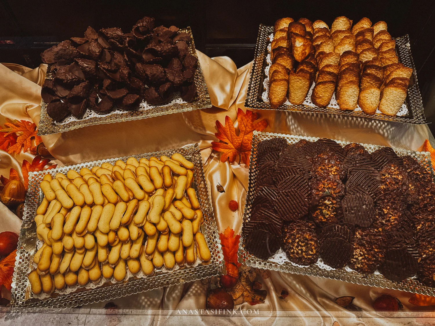 Trays of biscuits and chocolate-coated florentinas in a Gijón confitería display