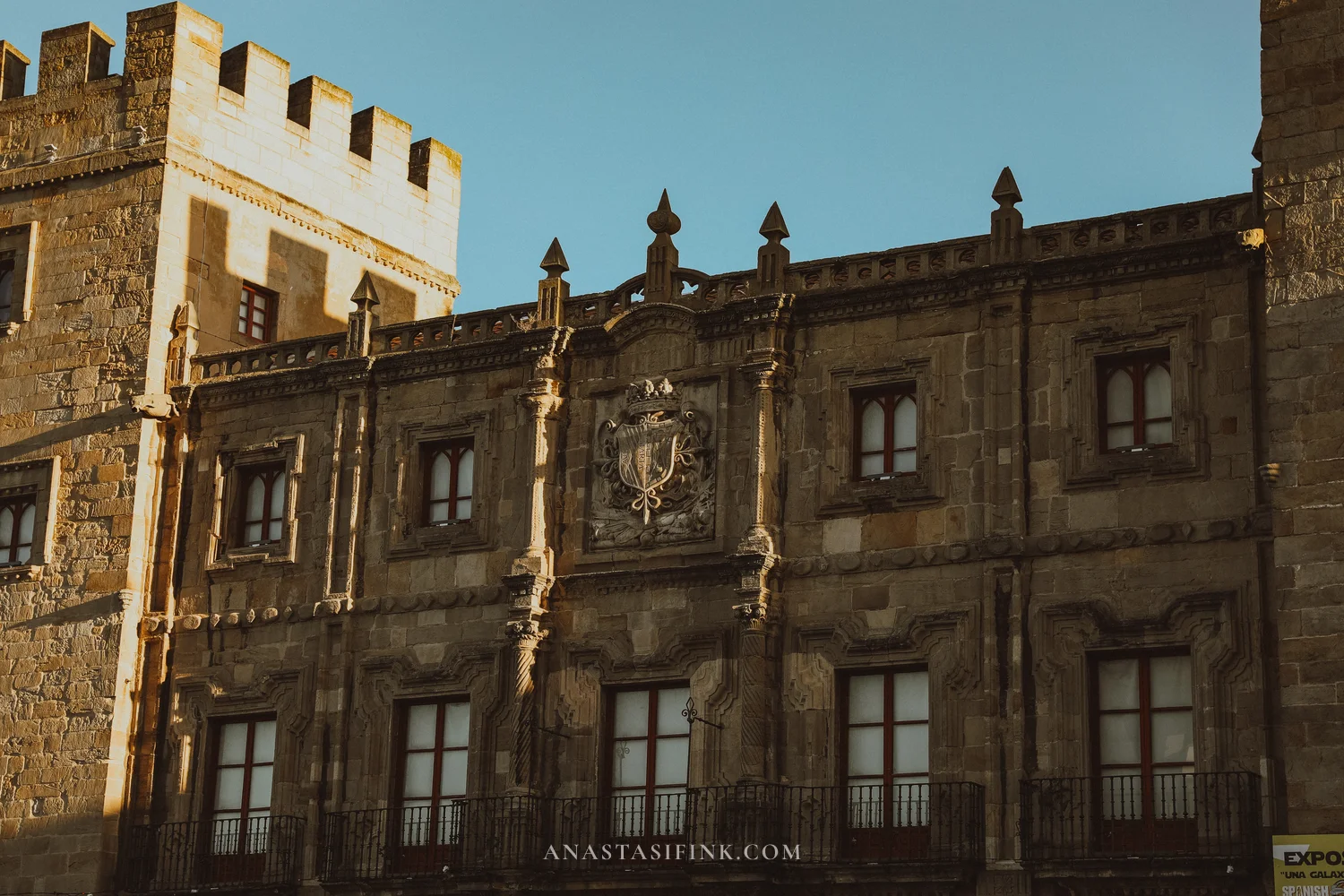 Baroque facade of Palacio de Revillagigedo in Gijón with a stone coat of arms