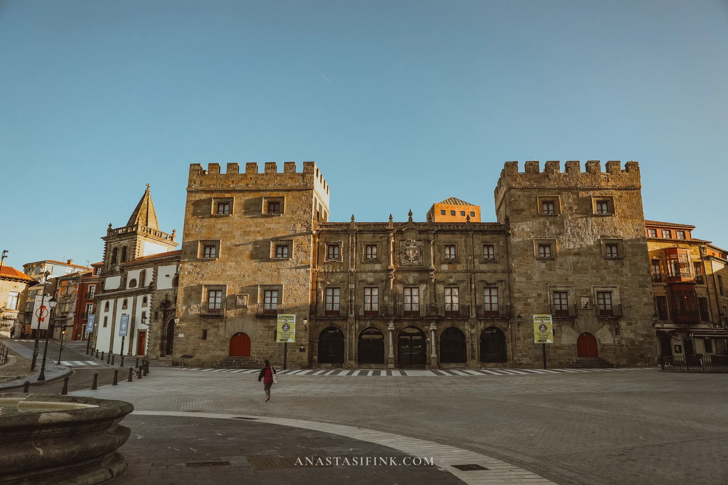 Palacio de Revillagigedo with two crenellated towers and the collegiate church on Plaza del Marqués, Gijón