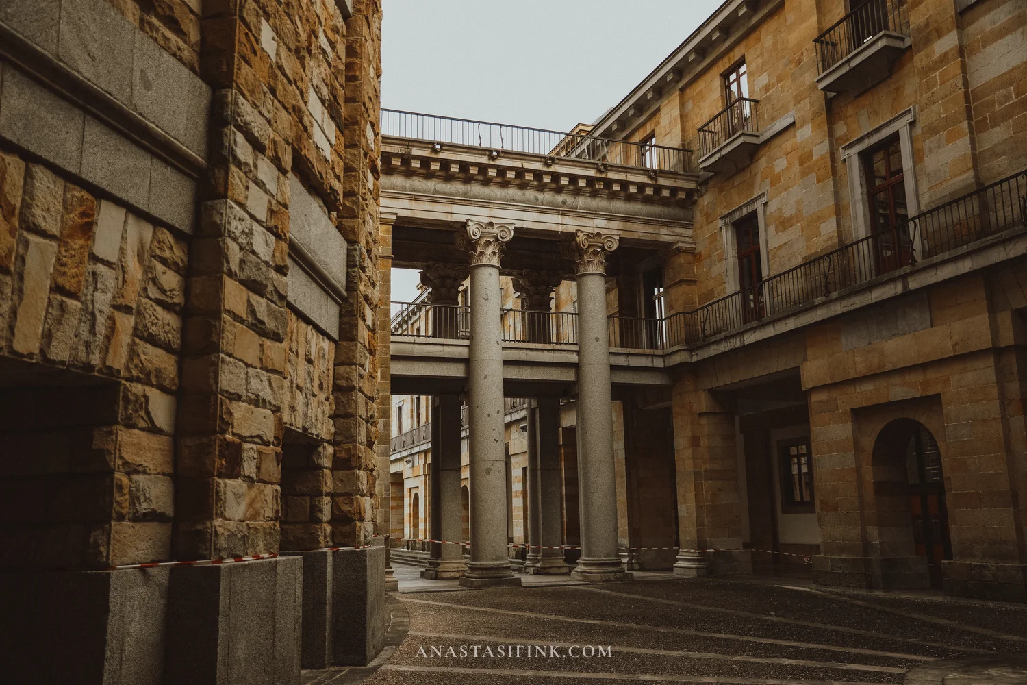 Corinthian colonnade and stone galleries inside Universidad Laboral in Gijón